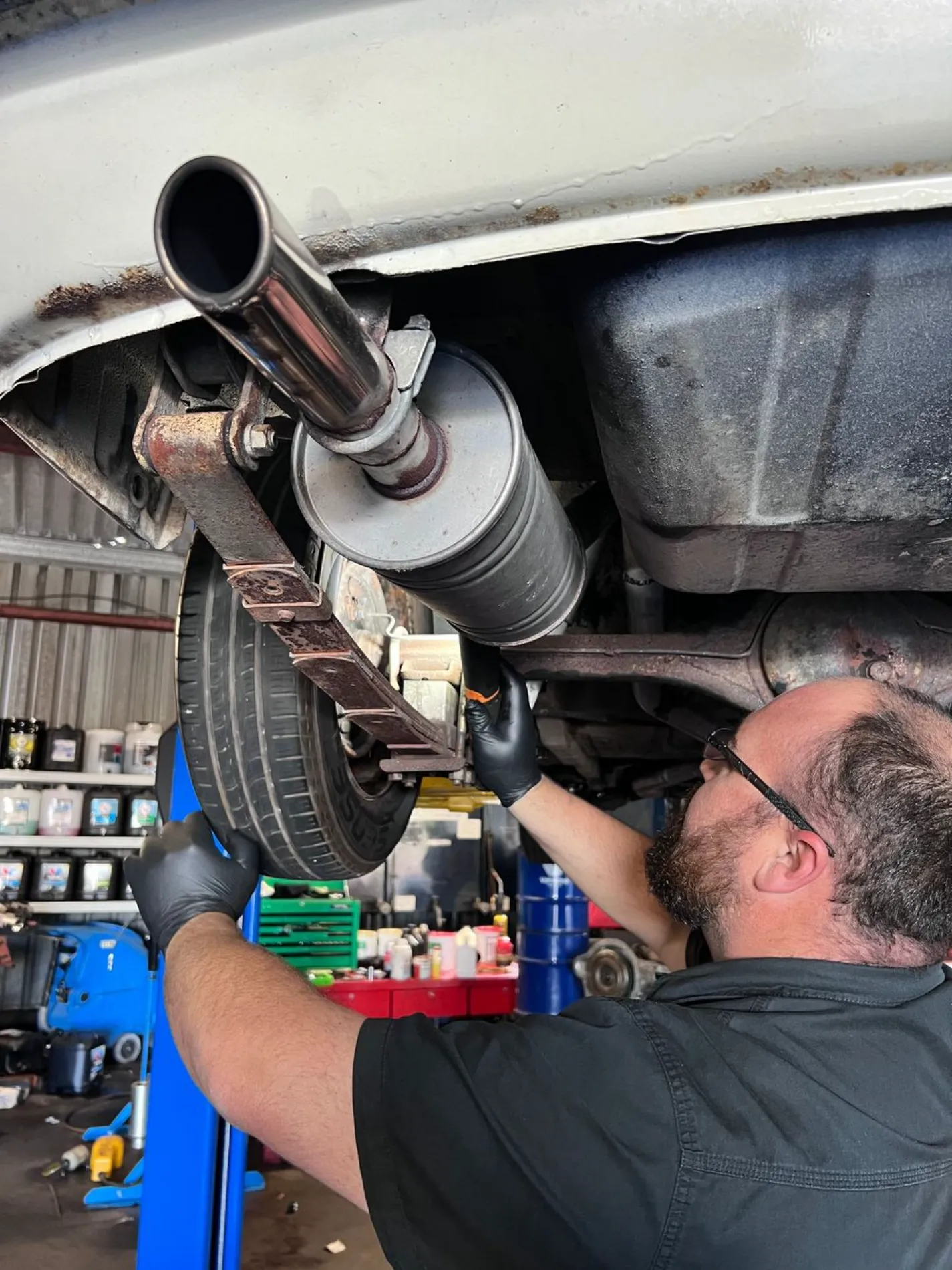 Mechanic carrying out a logbook service at Joe's Auto Service Centre in Forster