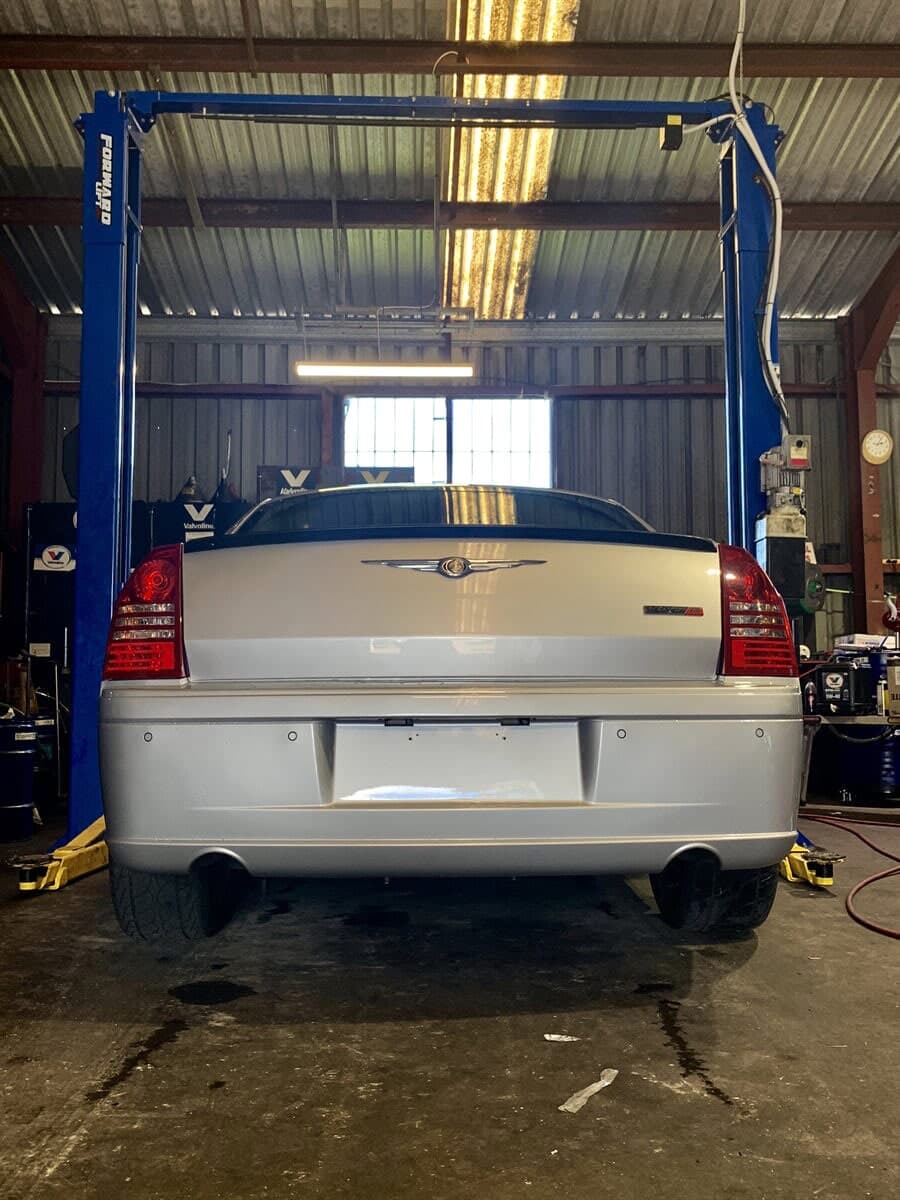 Back view of a vehicle in Joe's Auto Service Centre's workshop