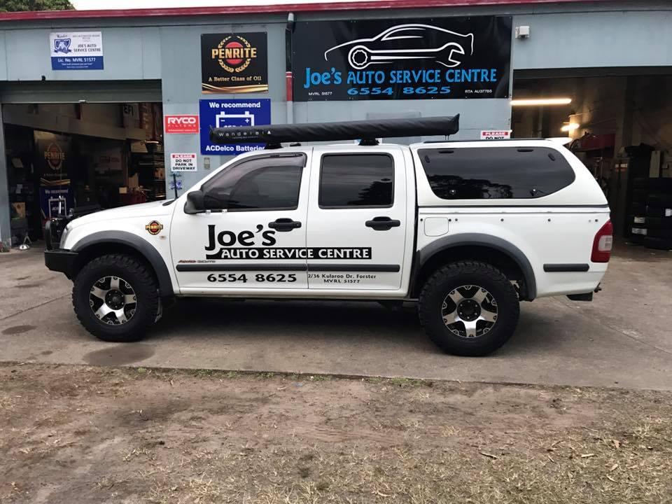 Joe's Auto Service Centre work vehicle parked in front of the workshop in Forster with signage